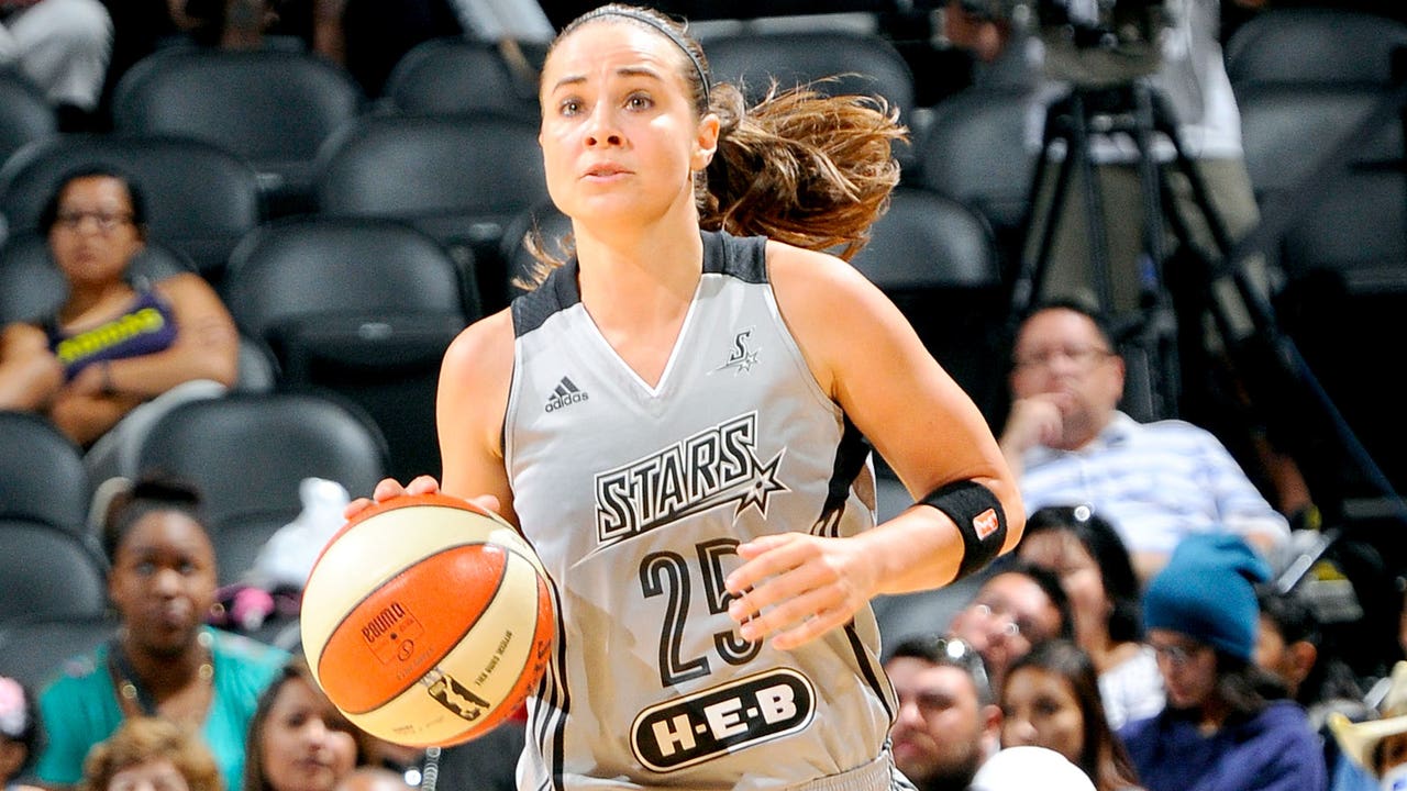 Hammon makes coaching history, but she's not quite done as a player
